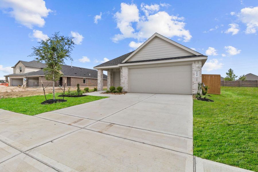 Front exterior of a new home in Cypress Green, Tomball, TX, highlighting curb appeal (Image 2). Front exterior of a new home in Cypress Green, Tomball, TX, highlighting curb appeal (Image 2).