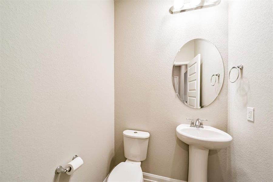 Downstairs half-bath with enough space for privacy and close distance to the dining and kitchen for the break you need