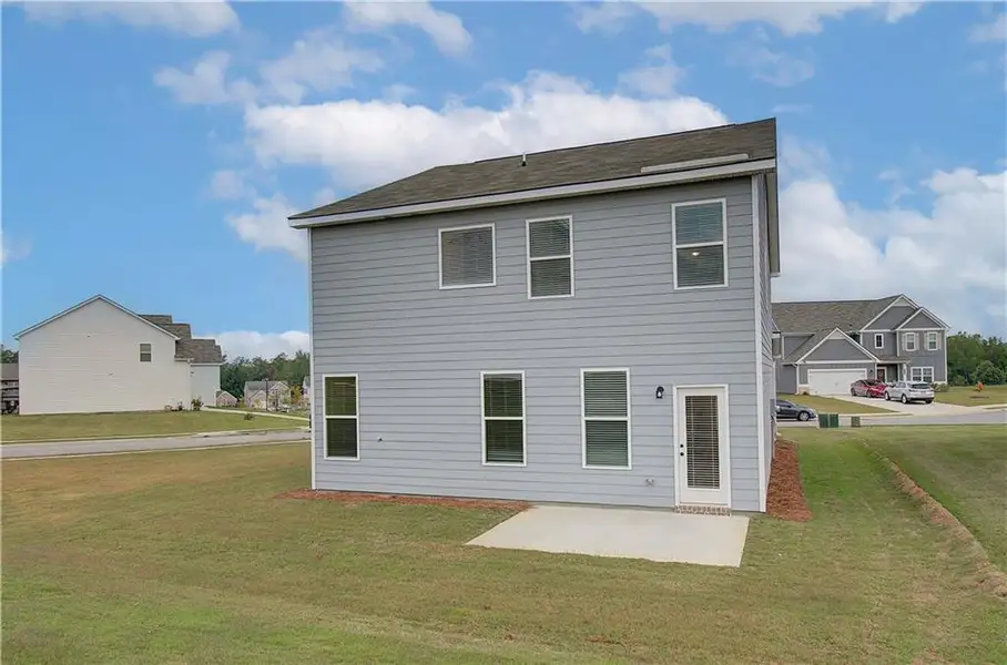 Exterior details and patio area of a home in Enclave at Evergreen, Fairburn (Image 4).