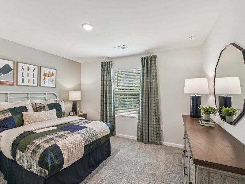 Secondary bedroom in the Chatham floorplan at a Meritage Homes community in Mebane, NC. Secondary bedroom in the Chatham floorplan at a Meritage Homes community in Mebane, NC.