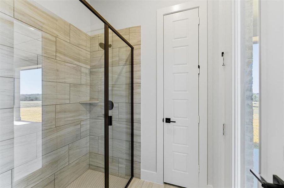 Bathroom featuring a shower stall