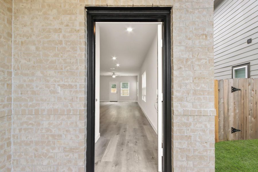 Exterior details and patio area of a home in Lonestar Collection at Granger Pines, Conroe (Image 17). Exterior details and patio area of a home in Lonestar Collection at Granger Pines, Conroe (Image 17).