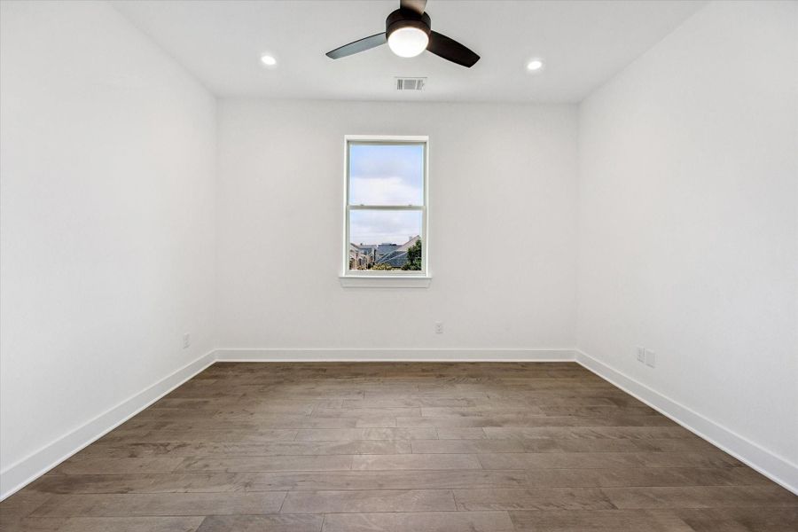 Secondary Bedroom on the Third Floor * Hardwood Floors * Recessed Lighting * Modern Ceiling Fan with Light. Secondary Bedroom on the Third Floor * Hardwood Floors * Recessed Lighting * Modern Ceiling Fan with Light.