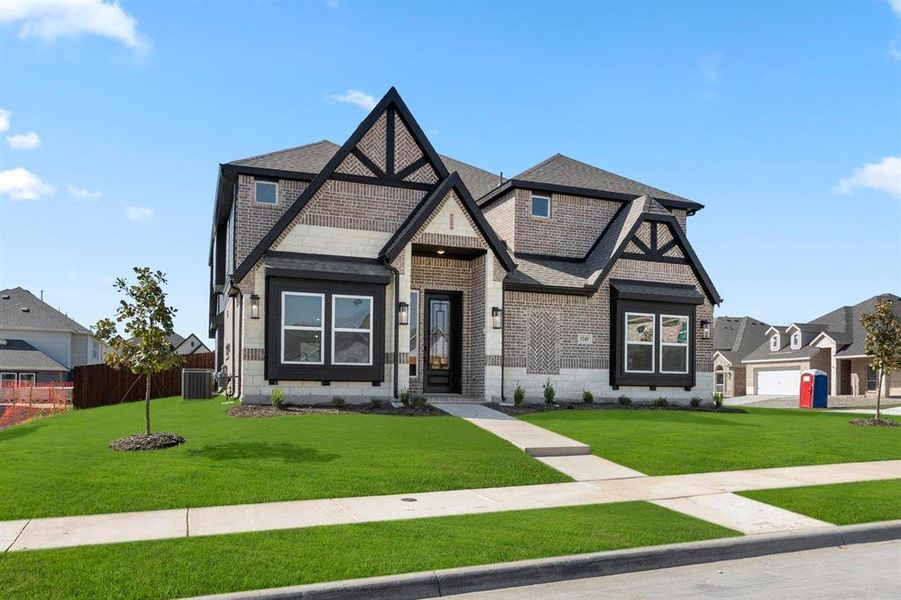 Front exterior of a new home in Marine Creek Ranch, Fort Worth, TX, highlighting curb appeal (Image 20). Front exterior of a new home in Marine Creek Ranch, Fort Worth, TX, highlighting curb appeal (Image 20).