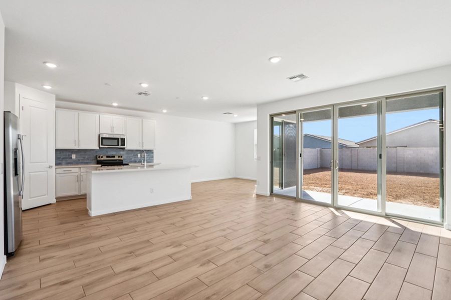 Great room, kitchen and dining. Representative images and renderings are for illustrative purposes. Actual structural options and design finishes of home may vary.