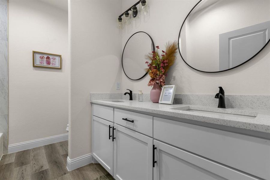 Bathroom with vanity and hardwood / wood-style floors