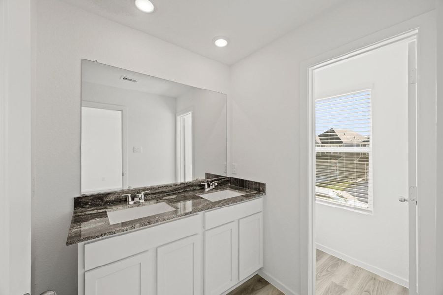 Furnished interior view inside a new home in Bridges on Lake Houston Villas, Humble (Image 6).