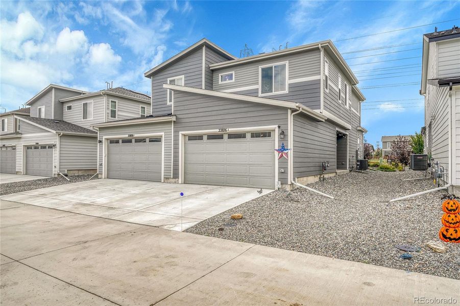 Exterior details and patio area of a home in Urban Collection at Copperleaf, Aurora (Image 17).