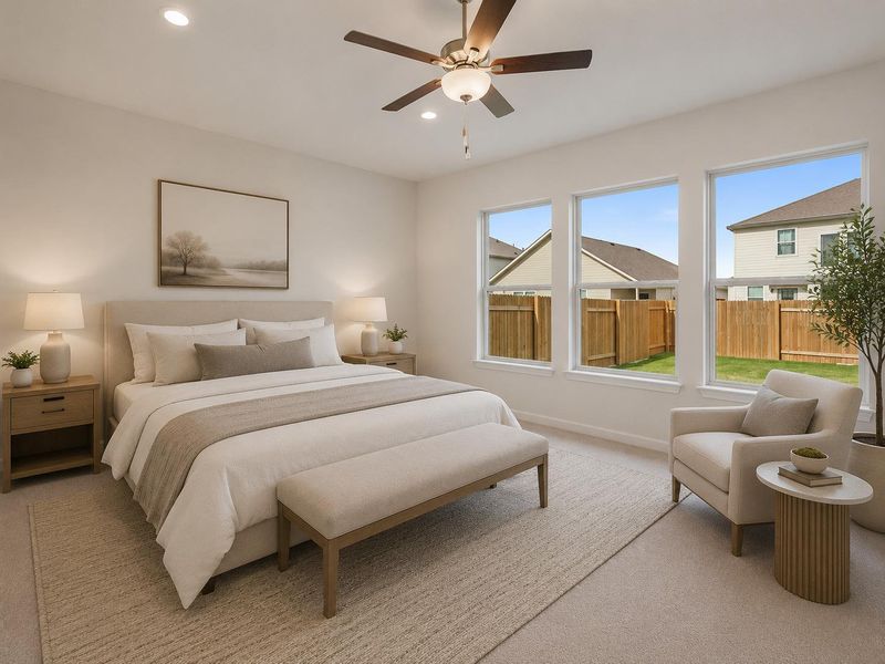 Sun-filled primary bedroom with plush carpeting and ample natural light. Sun-filled primary bedroom with plush carpeting and ample natural light.
