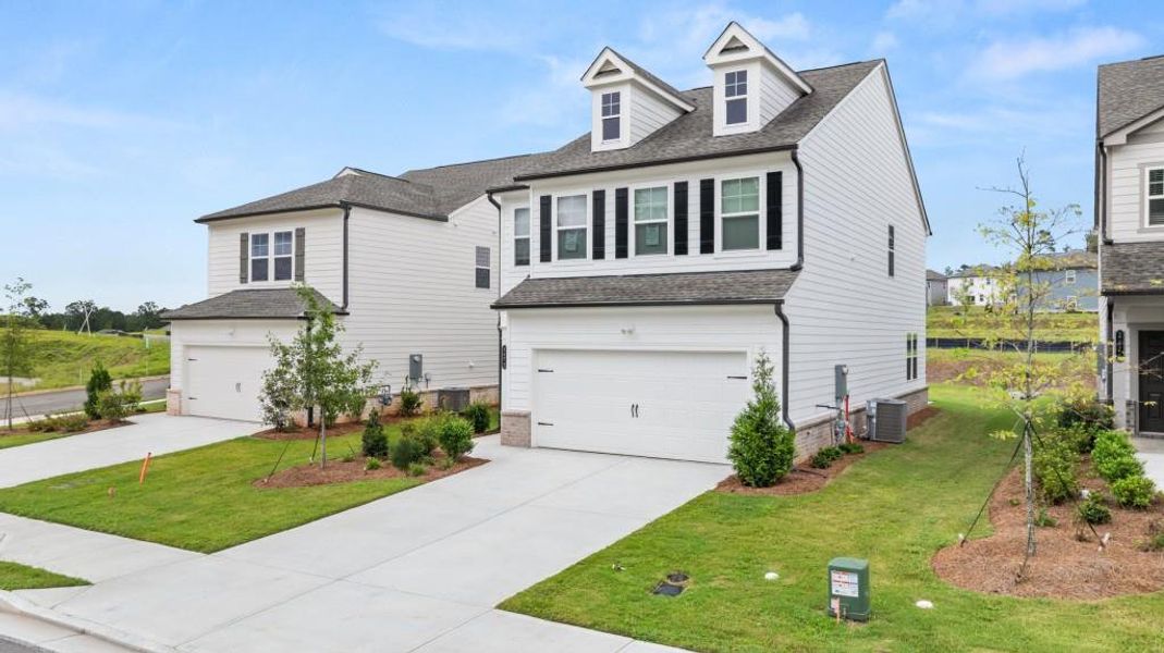 Front exterior of a new home in Timber Ridge: Timber Ridge 42', Douglasville, GA, highlighting curb appeal (Image 2). Front exterior of a new home in Timber Ridge: Timber Ridge 42', Douglasville, GA, highlighting curb appeal (Image 2).