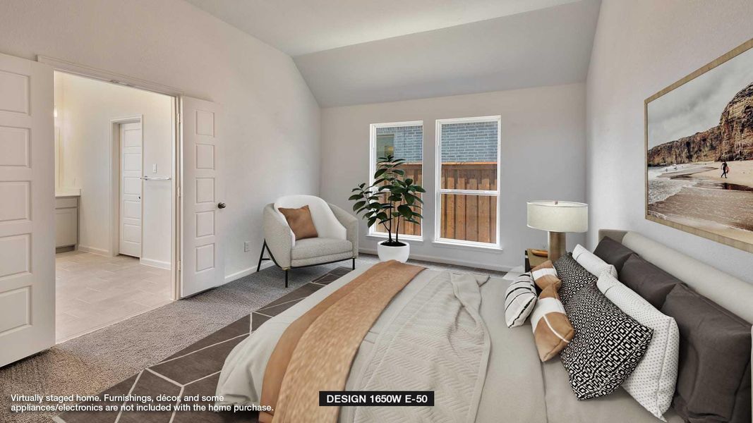 Carpeted bedroom featuring lofted ceiling and baseboards