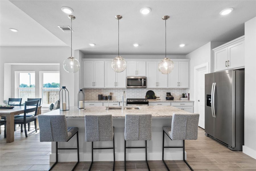 Kitchen comes equipped with a side-by-side Whirlpool refrigerator. Kitchen comes equipped with a side-by-side Whirlpool refrigerator.