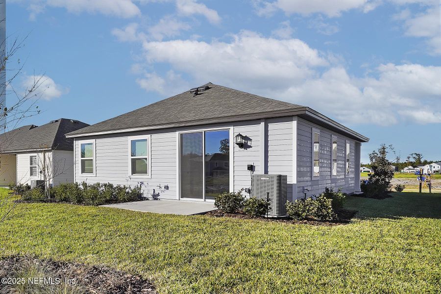 Front exterior of a new home in Jennings Farm, Middleburg, FL, highlighting curb appeal (Image 2).