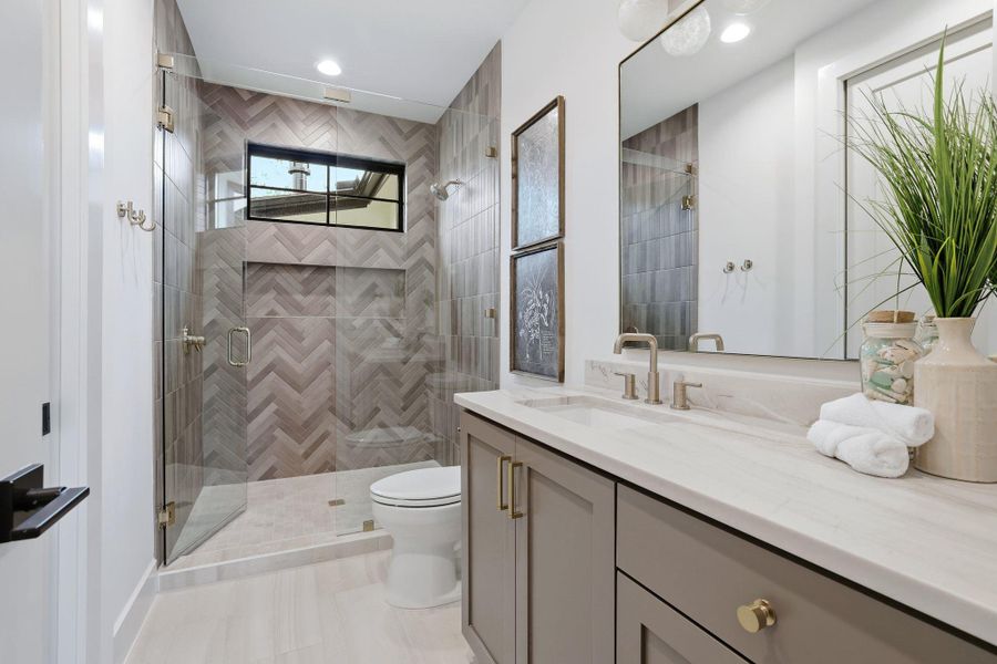 Full bath with vanity and a stall shower