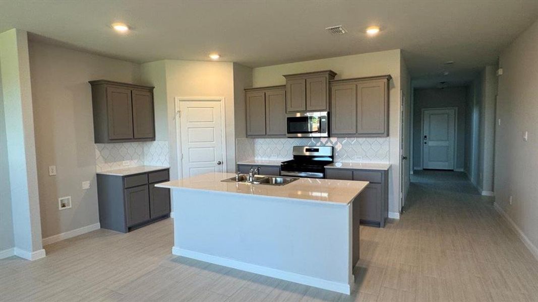 Kitchen- All Home and community information, including pricing, included features, terms, availability and amenities, are subject to change at any time without notice or obligation. All Drawings, pictures, photographs, video, square footages, floor plans, elevations, features, colors and sizes are approximate for illustration purposes only and will vary from the homes as built.