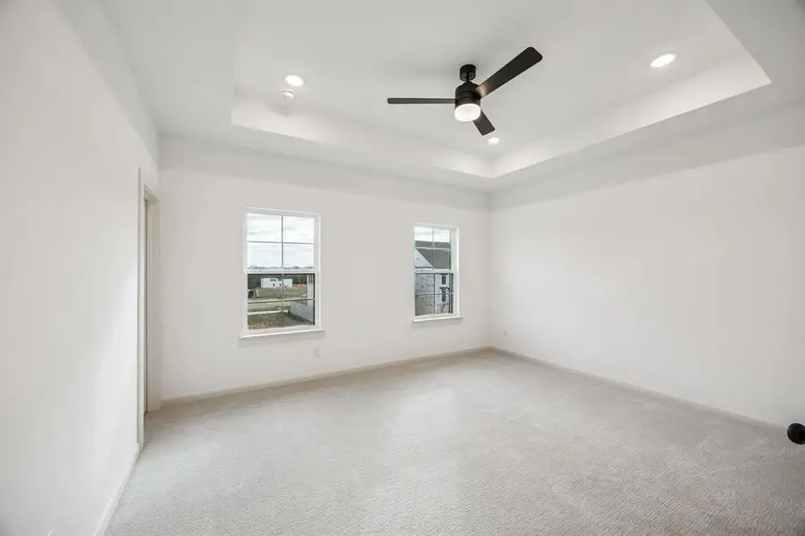 Featuring plush carpeting, high ceiling and wonderful natural light, this owners suite is a dream come true!