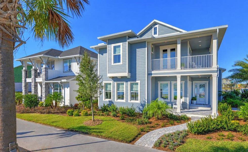 Front exterior of a new home in Laureate Park, Orlando, FL, highlighting curb appeal (Image 20).