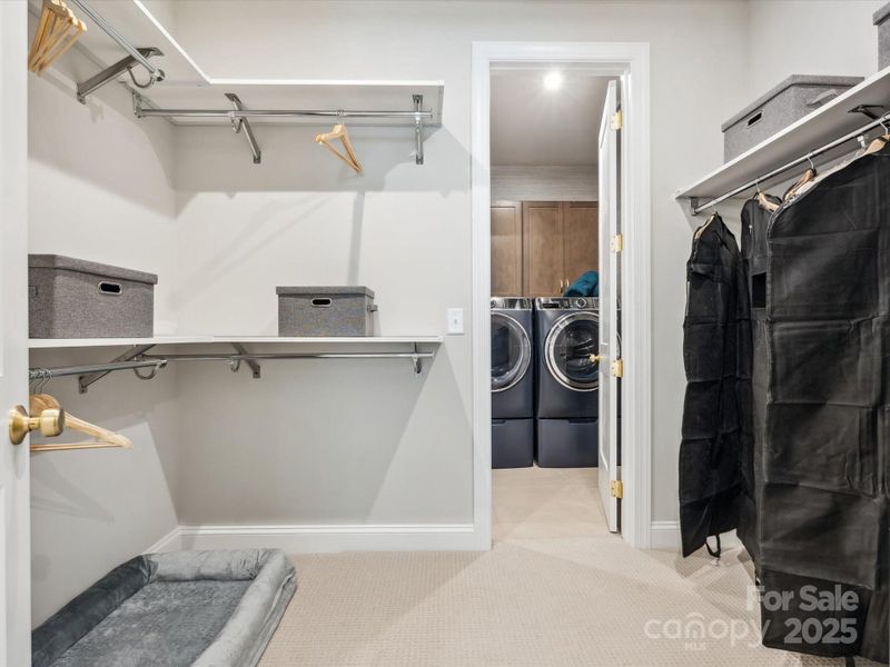 Generous Primary Closet Leading to Laundry Room. *Model Photos | Actual Finishes, Structural Selections, and Orientation May Vary. Generous Primary Closet Leading to Laundry Room. *Model Photos | Actual Finishes, Structural Selections, and Orientation May Vary.