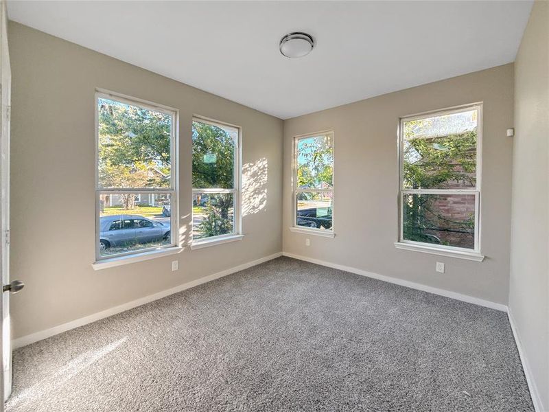 Unfurnished room with baseboards and carpet floors