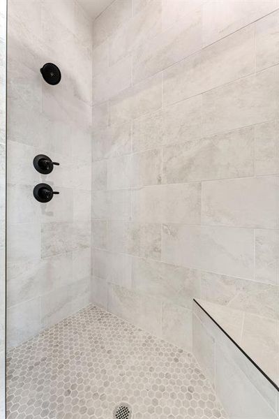 Bathroom featuring tiled shower