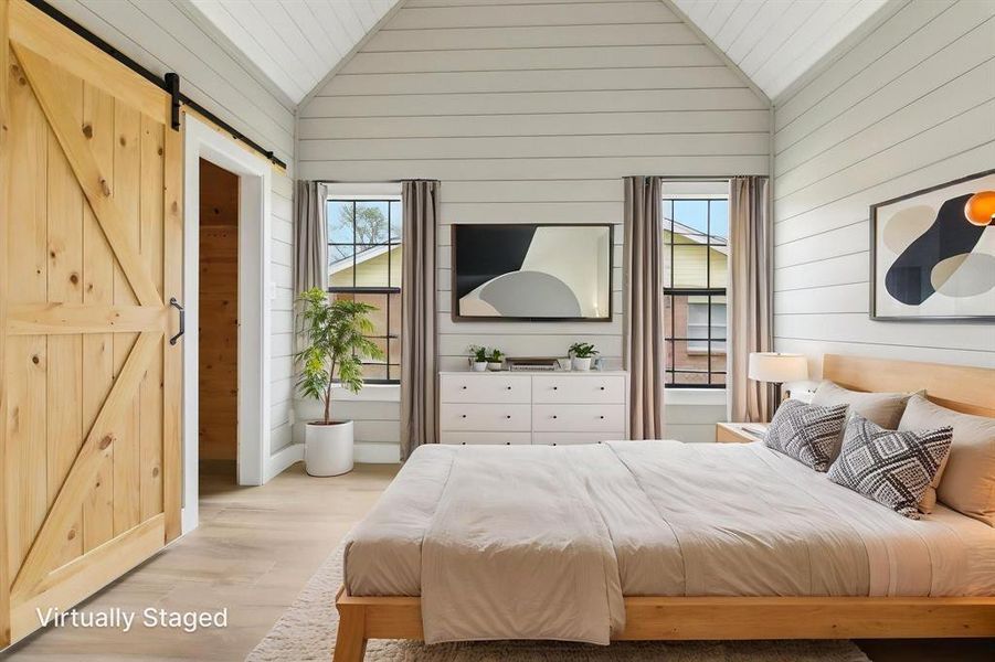 Primary bedroom with barn door closet