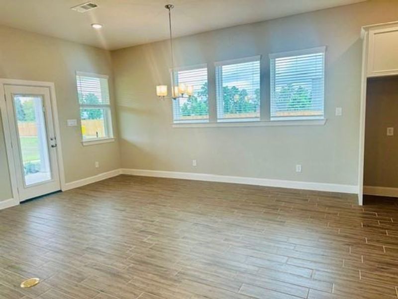 Large Dining area with lots of windows for light!