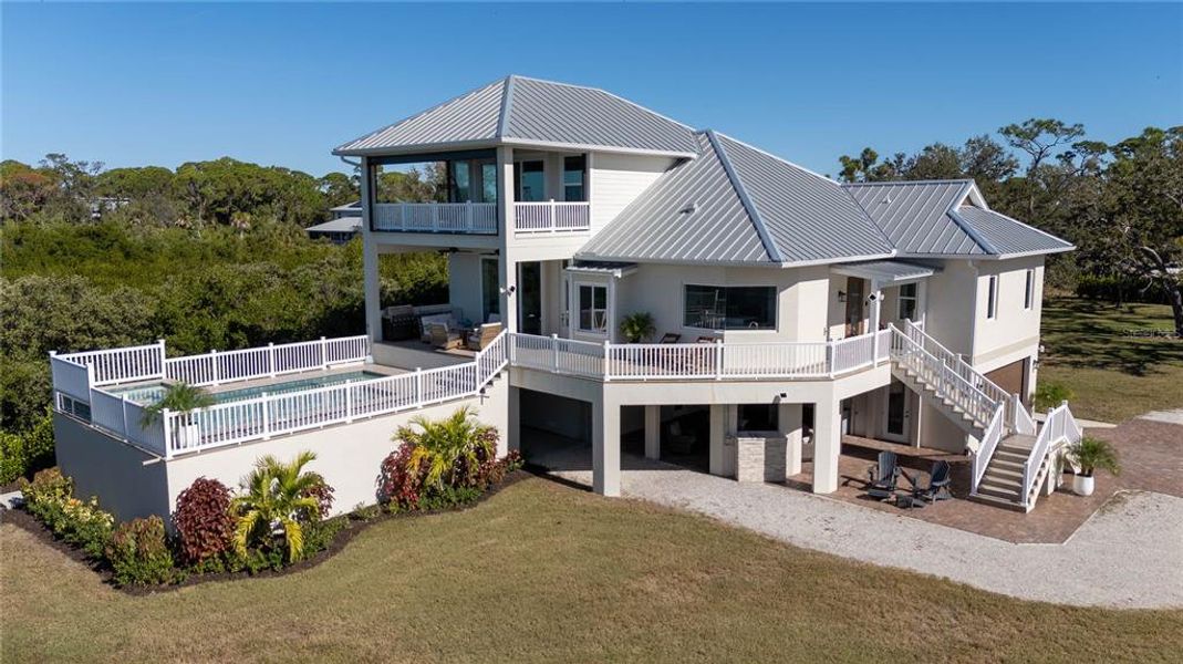 Front exterior of a new home in , Englewood, FL, highlighting curb appeal (Image 2).