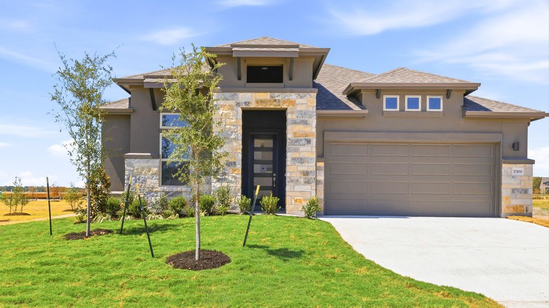 Front exterior of a new home in Preserve at Lakeside Meadows, Pflugerville, TX, highlighting curb appeal (Image 2). Front exterior of a new home in Preserve at Lakeside Meadows, Pflugerville, TX, highlighting curb appeal (Image 2).