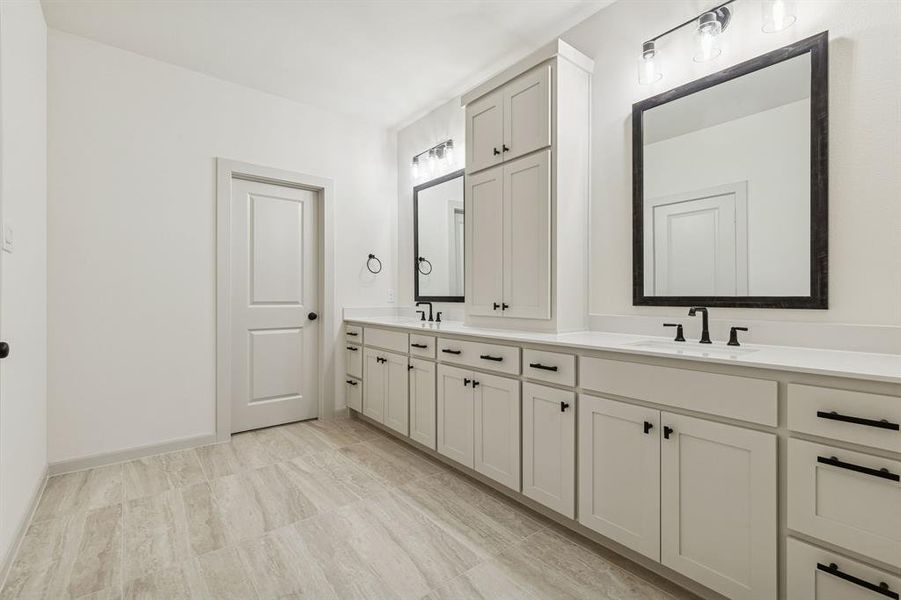 The thoughtful design of this owner's bath offers wonderful storage and plenty of room for two!