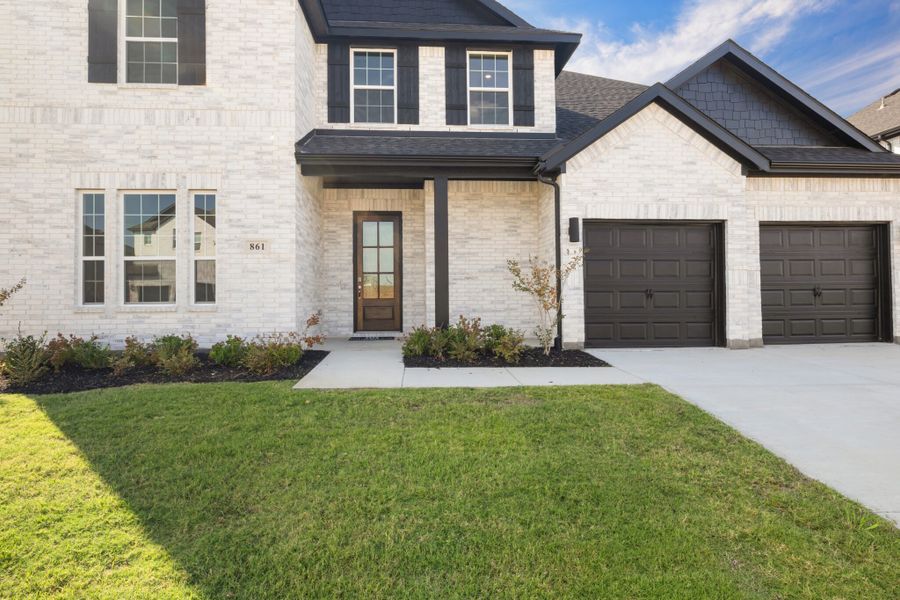 Front exterior of a new home in Lake Breeze, Lavon, TX, highlighting curb appeal (Image 23).