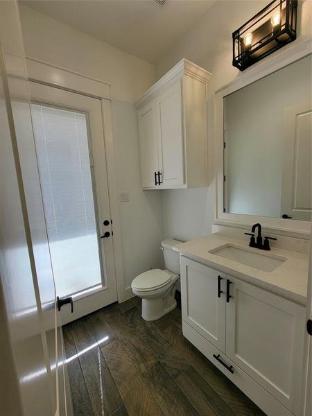 Bathroom featuring vanity and toilet