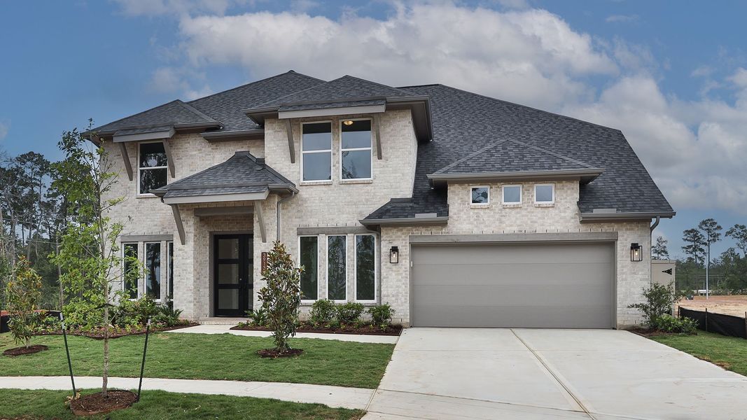 Front exterior of a new home in Audubon, Magnolia, TX, highlighting curb appeal (Image 1). Front exterior of a new home in Audubon, Magnolia, TX, highlighting curb appeal (Image 1).