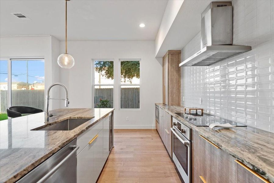 The designer kitchen is a dream. Featuring carrera marble countertops, Bosch appliances and an induction cooktop. The designer kitchen is a dream. Featuring carrera marble countertops, Bosch appliances and an induction cooktop.