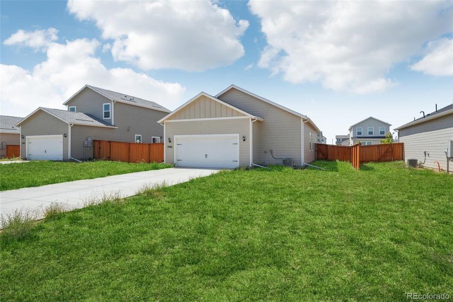 Front exterior of a new home in Wolf Creek Run, Strasburg, CO, highlighting curb appeal (Image 16).