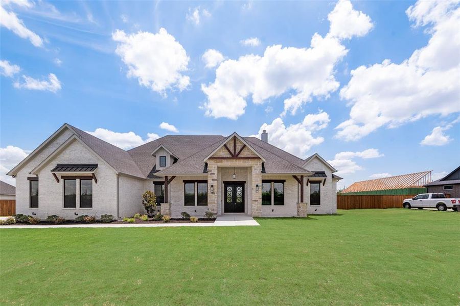 View of front of property featuring a front lawn