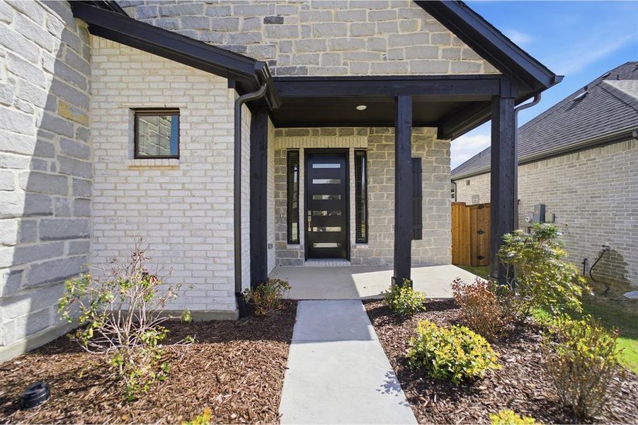 Exterior details and patio area of a home in Sonoma Verde, Rockwall (Image 3). Exterior details and patio area of a home in Sonoma Verde, Rockwall (Image 3).