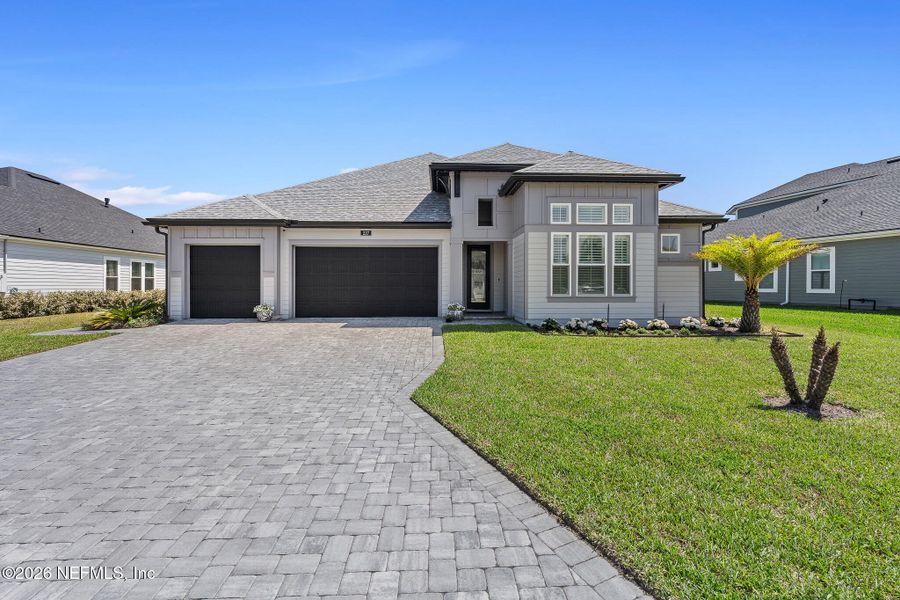 Front exterior of a new home in Marshes of Madeira, St. Augustine, FL, highlighting curb appeal (Image 2). Front exterior of a new home in Marshes of Madeira, St. Augustine, FL, highlighting curb appeal (Image 2).