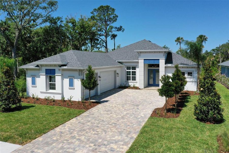Front exterior of a new home in , Palm Coast, FL, highlighting curb appeal (Image 32). Front exterior of a new home in , Palm Coast, FL, highlighting curb appeal (Image 32).