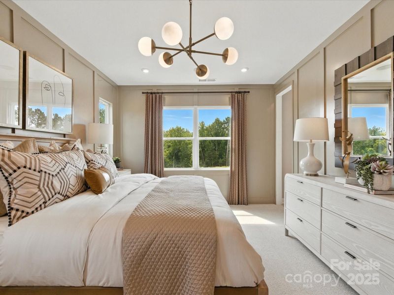 9' Ceilings and 8' doorways in the primary suite to take it to the next level. *Model Photos | Orientation and structural selections may vary. 9' Ceilings and 8' doorways in the primary suite to take it to the next level. *Model Photos | Orientation and structural selections may vary.