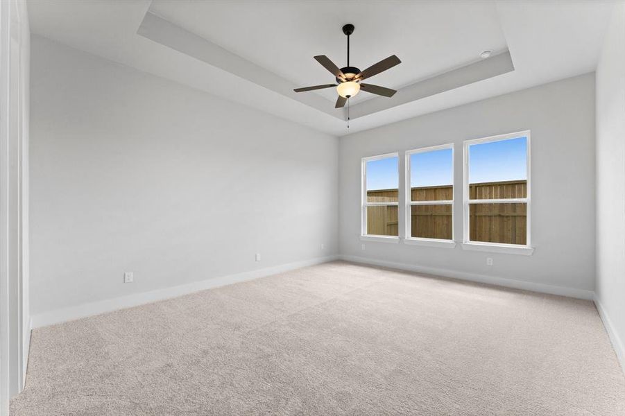 Primary Bedroom with Walk-in Closet and Fan.