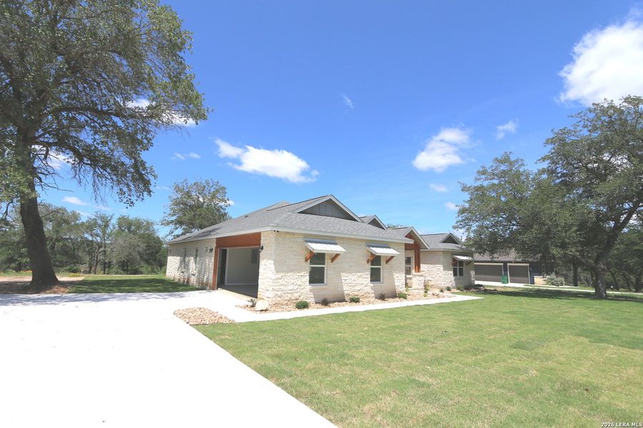 Front exterior of a new home in , La Vernia, TX, highlighting curb appeal (Image 16). Front exterior of a new home in , La Vernia, TX, highlighting curb appeal (Image 16).