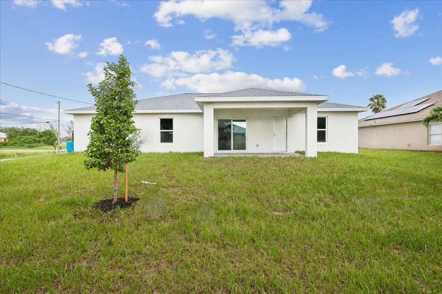 Representative exterior photo of a completed home built from the The Sunshine Retreat by Sunlife Homes LLC in Cape Coral, Cape Coral, FL (Image 2).