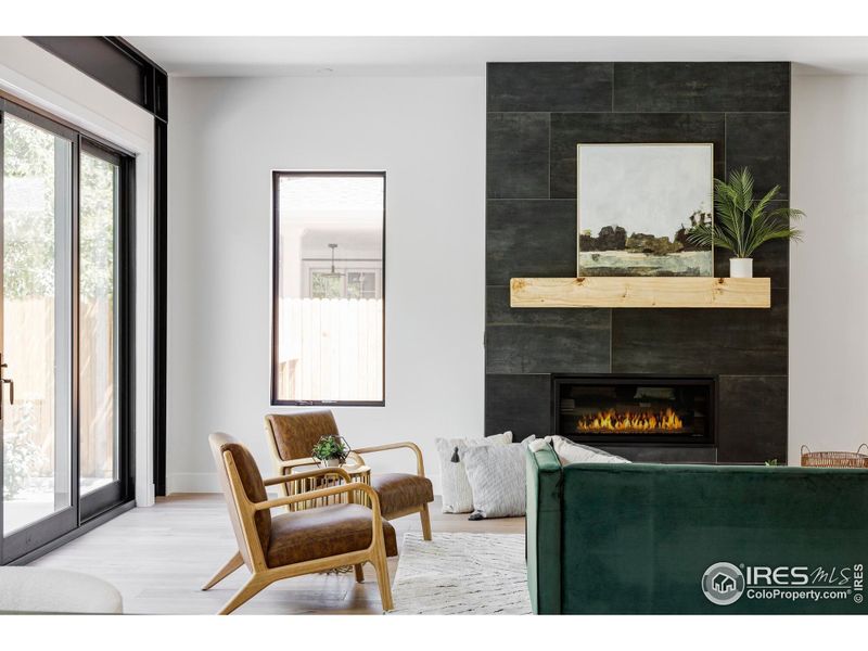 The home's custom wood accents were milled from trees that stood on the property, including the cottonwood fireplace mantle in the great room and honey locust shelving that runs throughout.