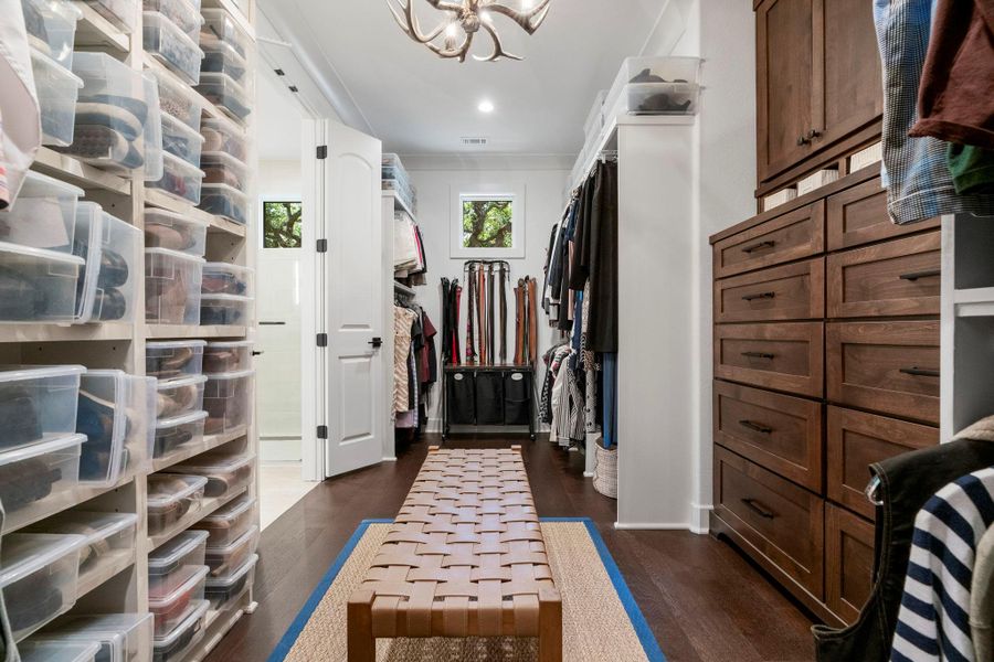 Custom built-in drawers in the spacious primary closet. Custom built-in drawers in the spacious primary closet.