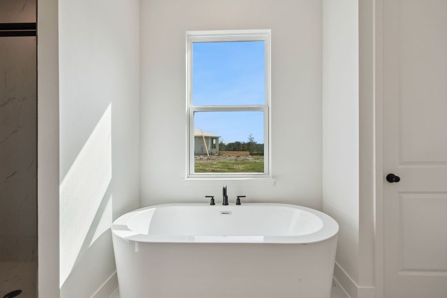 Spa-Inspired tub in Primary Bathroom Spa-Inspired tub in Primary Bathroom