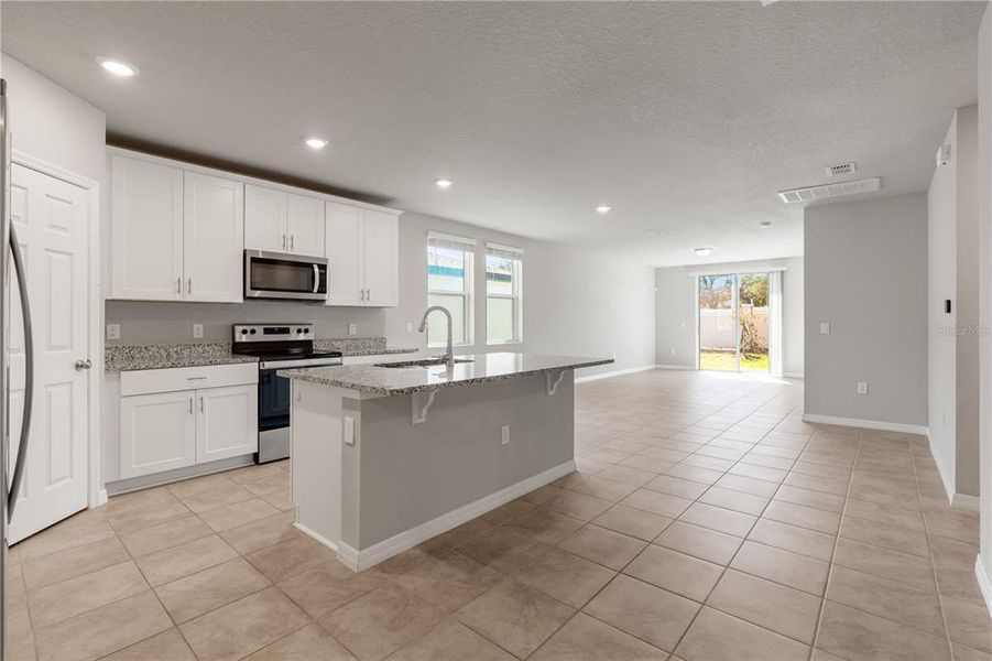 OPEN CONCEPT - KITCHEN + LIVING AREA