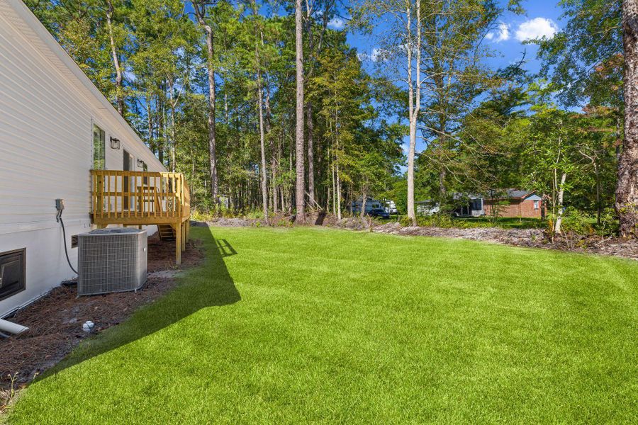 Exterior details and patio area of a home in , Ravenel (Image 27). Exterior details and patio area of a home in , Ravenel (Image 27).