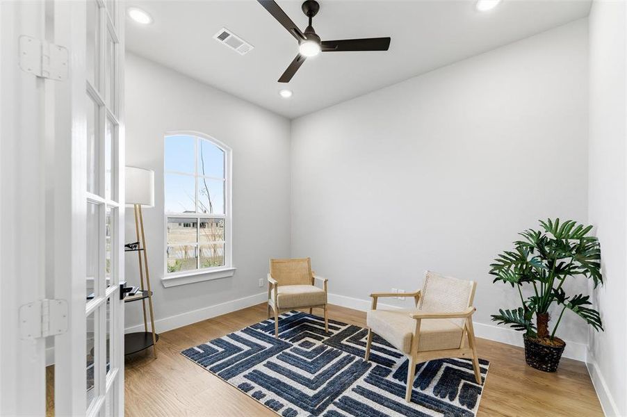 Living area featuring light wood-type flooring, recessed lighting, french doors, and ceiling fan