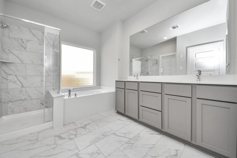 Elevate your daily routine at the elegant vanity, now equipped with double sinks, light countertops, modern hardware, and beautiful recessed lights. Elevate your daily routine at the elegant vanity, now equipped with double sinks, light countertops, modern hardware, and beautiful recessed lights.