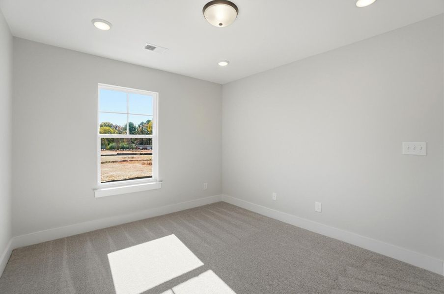 Spacious, unfurnished interior of a new home in Blythe Mill Townhomes, Waxhaw (Image 56).